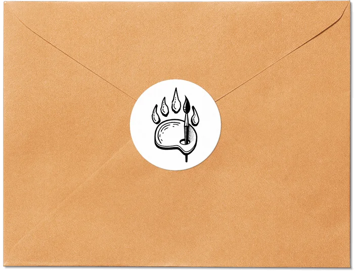 A brown envelope with a round sticker sealing it. The sticker has the Bearly Creative logo as motif.